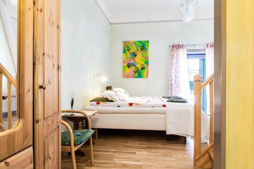 Postel nebo postele na pokoji v ubytování Kullagården