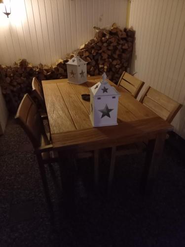 a wooden table with two boxes on top of it at Khaki Campbell in Ermelo