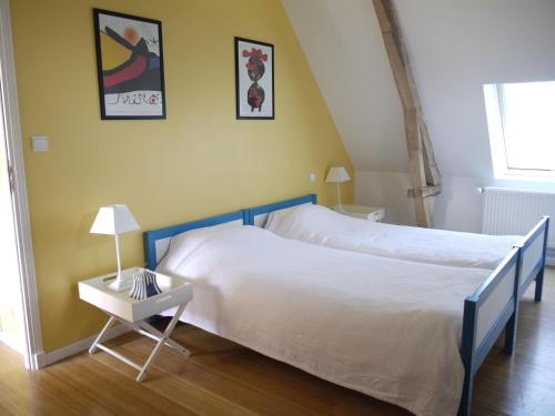 Postel nebo postele na pokoji v ubytování Gîte de la Ferme Rose