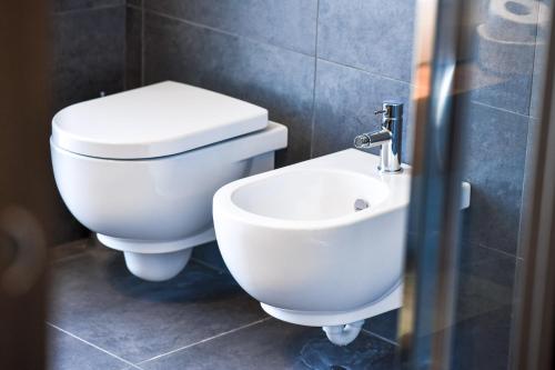 a bathroom with a toilet and a sink at Chalet Everest - Luxury Apartments in Prato Nevoso