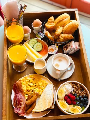a tray of breakfast foods on a table at The Highlander Amsterdam in Amsterdam