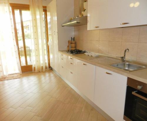 a kitchen with a sink and a counter top at Paradiso Lux in Lazise