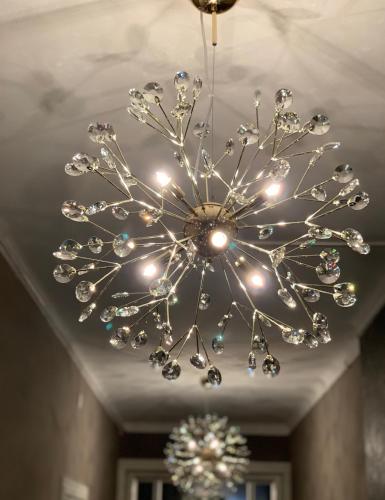 a chandelier hanging from a ceiling in a room at Ludvika Stadshotell in Ludvika
