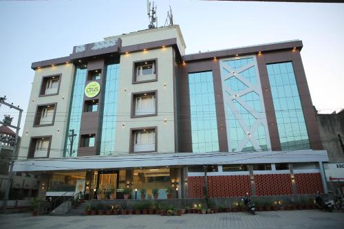 a building with a clock on the top of it at Citrus Prime Raipur in Raipur