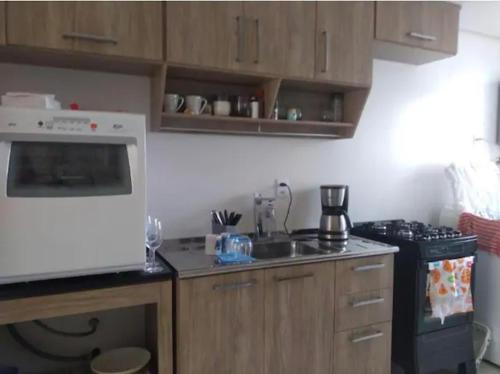 A kitchen or kitchenette at Morro das Pedras, Santa Catarina, Brasil