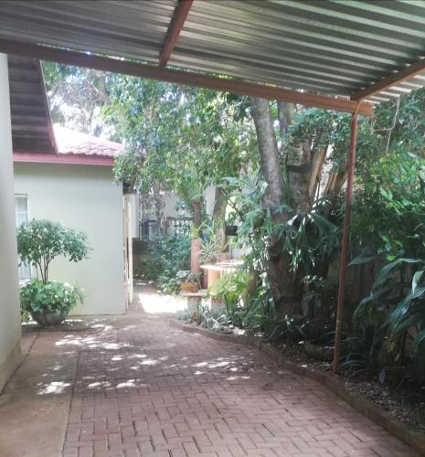 a patio with awning in front of a house at A-Cody Place in Louis Trichardt