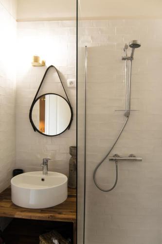 a bathroom with a sink and a mirror at Villa Louisa in Saint Malo