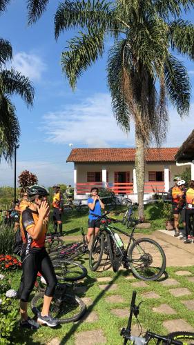 a group of people standing next to their bikes at Atma Anna in Piedade
