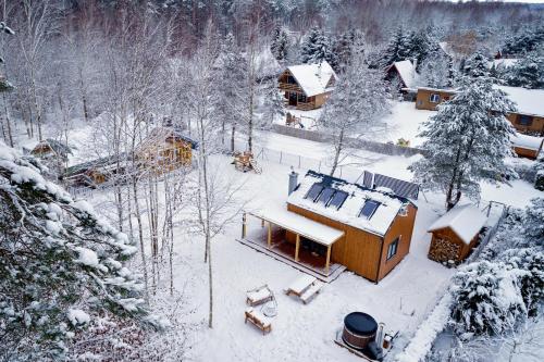 an aerial view of a house covered in snow at Winiec Family Houses in Winiec