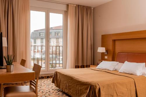 En eller flere senge i et værelse på Hotel Smarjeta - Terme Krka