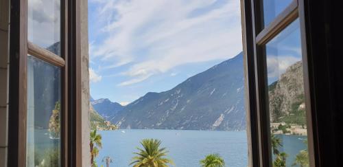 a view of a lake from a window at Albergo Bellavista in Limone sul Garda