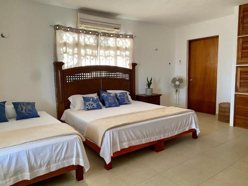 מיטה או מיטות בחדר ב-Casa Pescador Bacalar