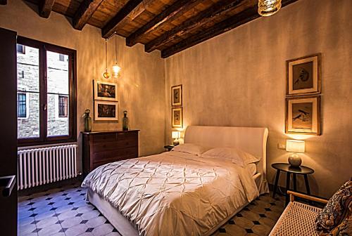 a bedroom with a bed and a window at Cà Fenice Design in Venice