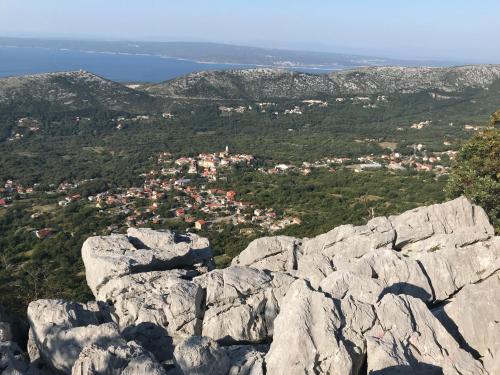 a view from the top of a rocky mountain at LOFT-Beach-apartments RATKO in Novi Vinodolski