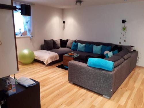 a living room with a couch and a table at Apart Linde inkl Silvretta Card in See