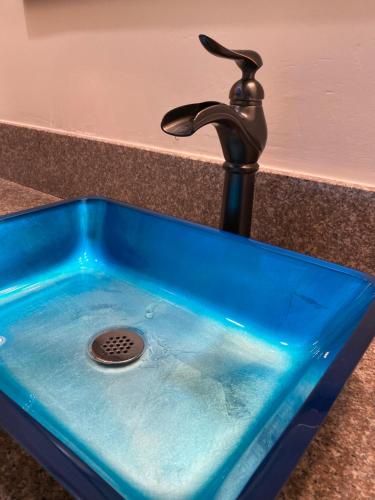 a sink with a water faucet in a counter at Villa Rosa Inn in Santa Barbara