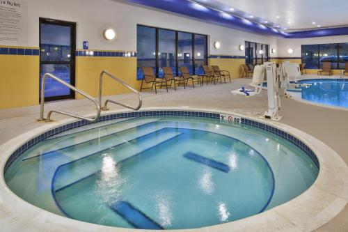 a large swimming pool in a hotel room at Holiday Inn Express & Suites Washington - Meadow Lands by IHG in Washington