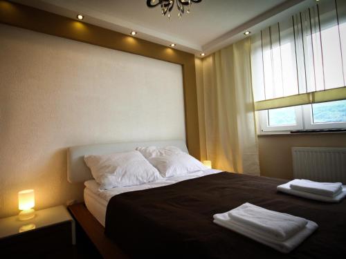 Ein Bett oder Betten in einem Zimmer der Unterkunft Apartament Martyna