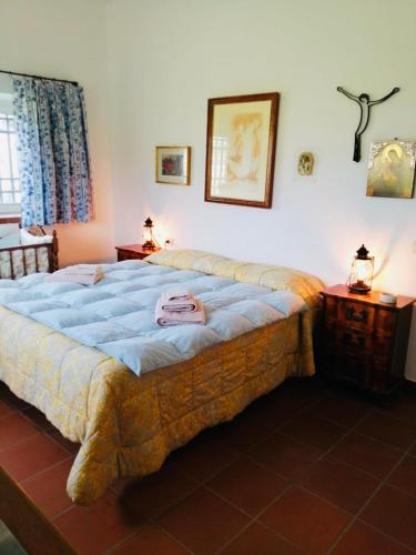 a bedroom with a large bed in a room at Villa Sara di Puglia in Castellaneta