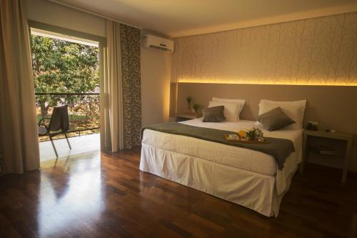 Cama ou camas em um quarto em Grand Carimã Resort & Convention Center