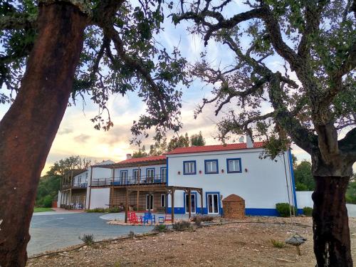 a large white building with a red roof at Monte Corgo da Vaca in Sabóia