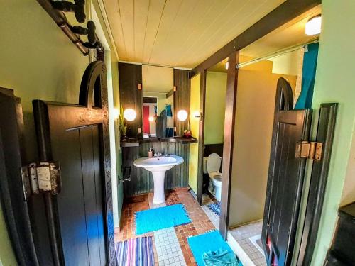 a bathroom with a sink and a toilet in it at MOOREA - Local Spirit Iti 2 in Hauru