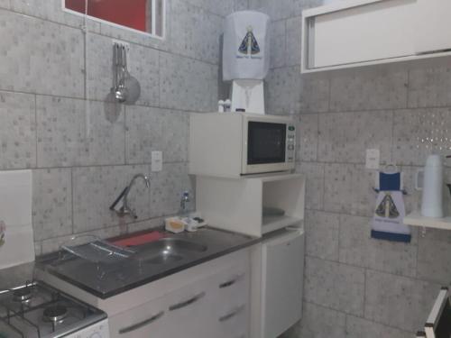 Kuchyň nebo kuchyňský kout v ubytování Flat familiar com ar,wi fi,cozinha e garagem