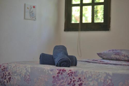 Un pat sau paturi într-o cameră la MangoBrazil