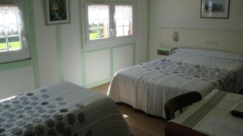 Ένα ή περισσότερα κρεβάτια σε δωμάτιο στο Hotel Pikassaria