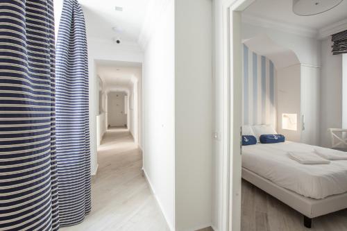 two images of a bedroom with a bed and a hallway at Hotel Marina Charming Rooms in Finale Ligure