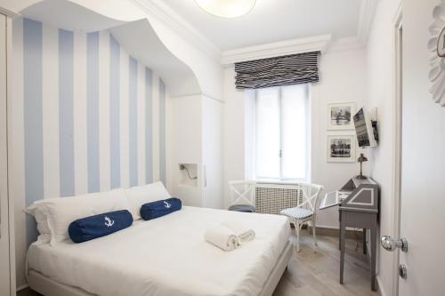 Posteľ alebo postele v izbe v ubytovaní Hotel Marina Charming Rooms
