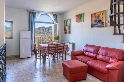 a living room with a couch and a table at Residence al Foionco in Lucca