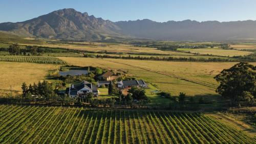 an aerial view of a house in the middle of a field at Raptor Rise in Tulbagh