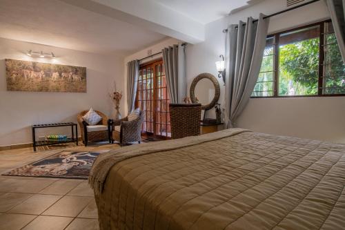 Ένα ή περισσότερα κρεβάτια σε δωμάτιο στο Elephant Coast Guesthouse