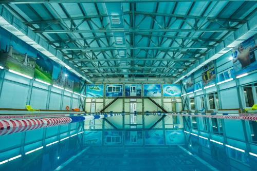 a large swimming pool with a ceiling at Armkhi Hotel Ingushetia - Все включено in Armkhi