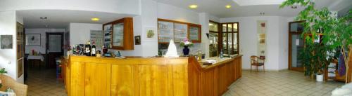 a salon with a wooden counter in a room at Sontheimer Wirtshäusle in Sontheim im Stubental