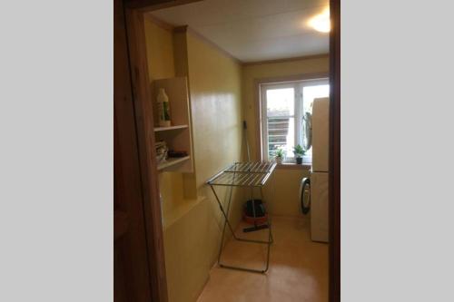 a small kitchen with a table and a window at The house of Mattis in beautiful Innvik in Innvik