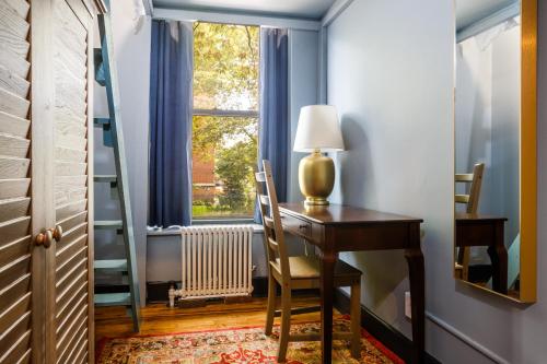 a home office with a desk and a window at Lamartine Chelsea in New York