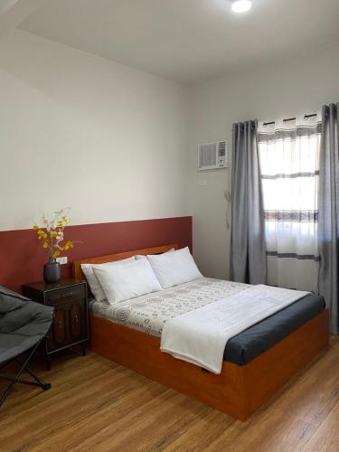 Posteľ alebo postele v izbe v ubytovaní Doroteo's Transient House