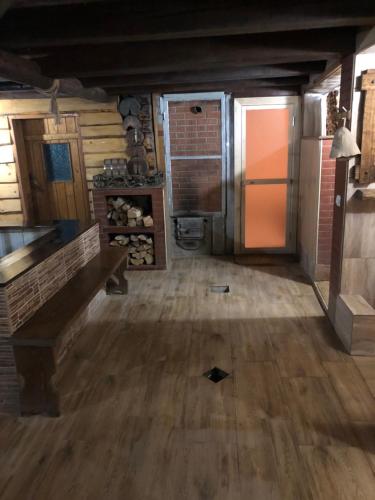 an empty room with a wooden floor and a door at Nautilus in Uzhhorod