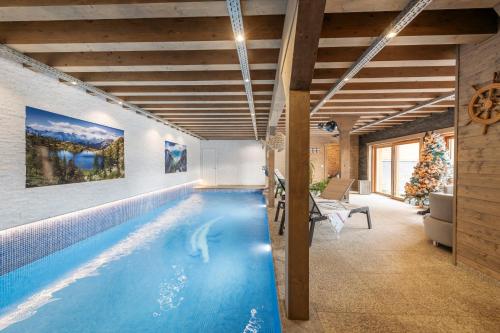 a swimming pool in a house at De Blockhut in Grône