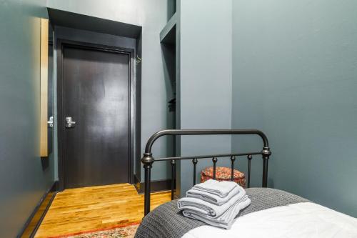 a bedroom with a bed with towels on it at Lamartine Chelsea in New York
