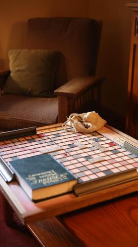 a table with two books and a book on it at Settlers Inn in Hawley