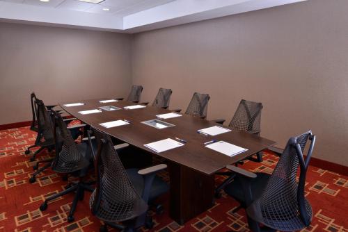 a conference room with a wooden table and chairs at Holiday Inn Express & Suites Page - Lake Powell Area by IHG in Page