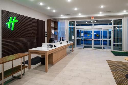an office with a reception desk in a building at Holiday Inn Fort Worth - Alliance by IHG in Fort Worth