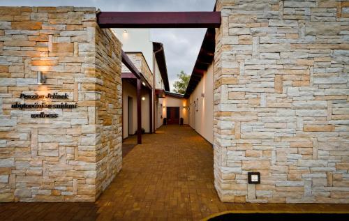 a stone walled hallway of a building at Penzion Jelínek in Opočno