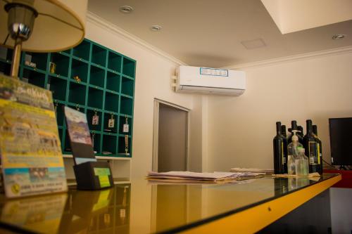 a room with bottles of wine sitting on a counter at WISZ-V in Belén
