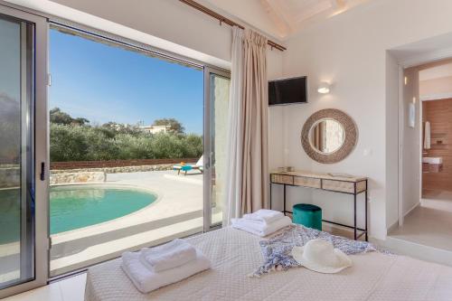 Ένα ή περισσότερα κρεβάτια σε δωμάτιο στο Canna Villa