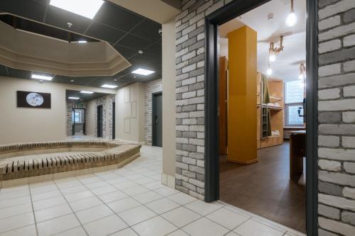 a hallway with a brick wall at Shagdi Hotel in Moscow