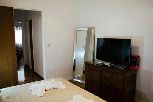a bedroom with a bed and a tv on a dresser at Administracion Callao in Buenos Aires
